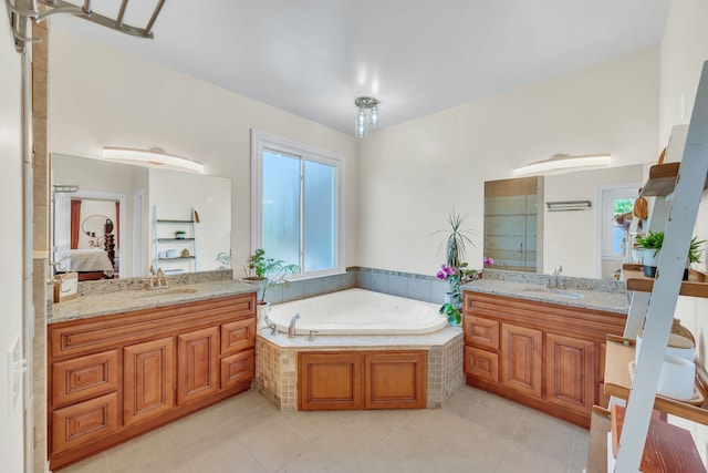 bathroom with shower with separate bathtub, tile patterned flooring, and vanity