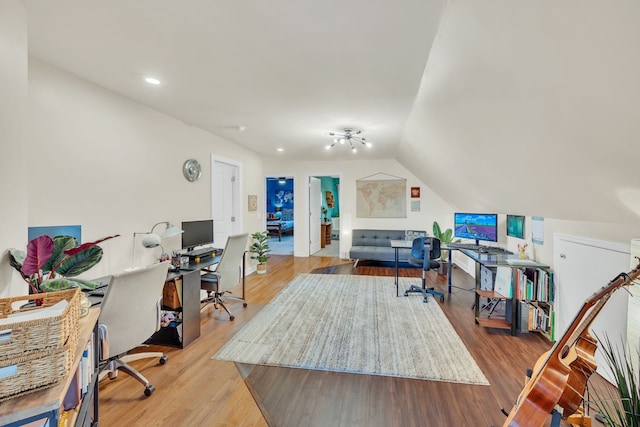 office area featuring light hardwood / wood-style flooring and vaulted ceiling