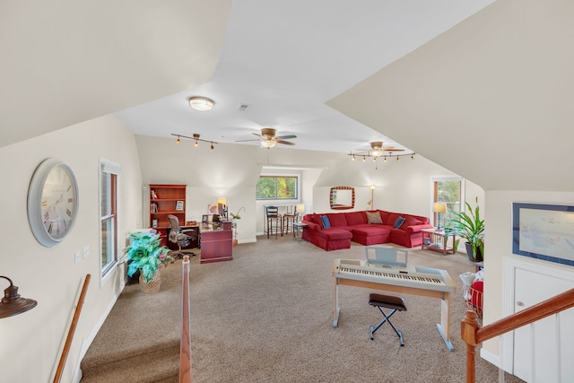 carpeted living room featuring vaulted ceiling, ceiling fan, and track lighting