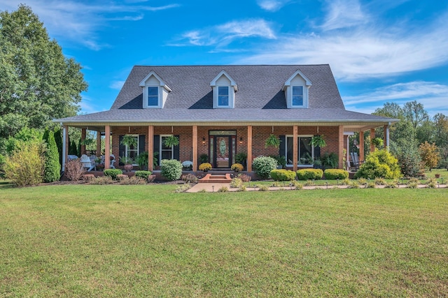 view of front of house with a porch and a front yard