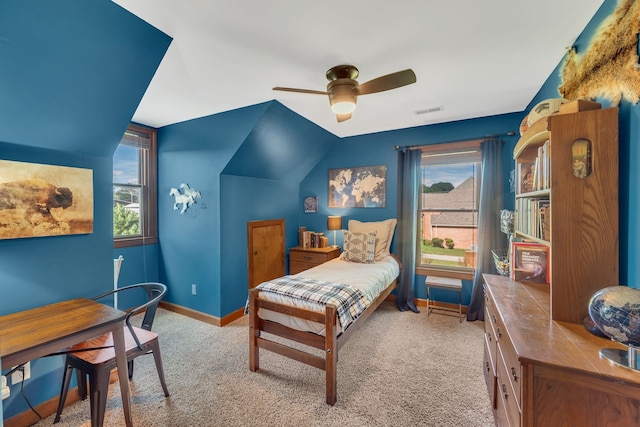 carpeted bedroom featuring vaulted ceiling and ceiling fan