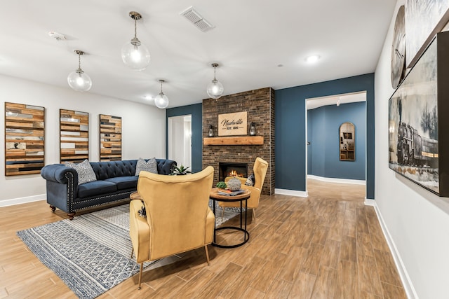 living room featuring a fireplace and hardwood / wood-style floors