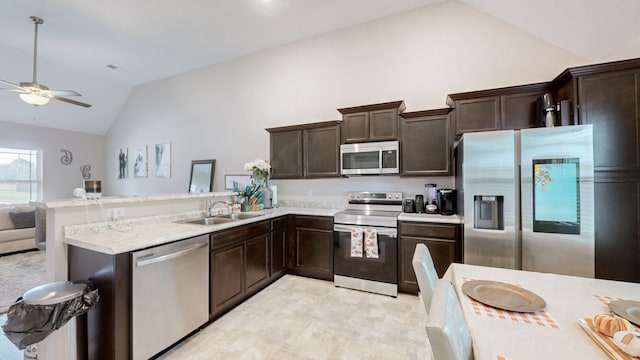 kitchen featuring sink, kitchen peninsula, dark brown cabinets, high vaulted ceiling, and appliances with stainless steel finishes