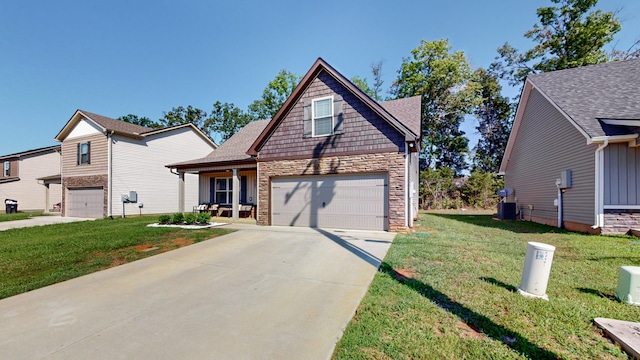 view of front of home featuring a garage and a front yard