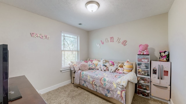 carpeted bedroom with a textured ceiling