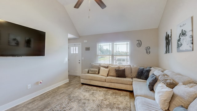 living room with wood-type flooring, high vaulted ceiling, and ceiling fan