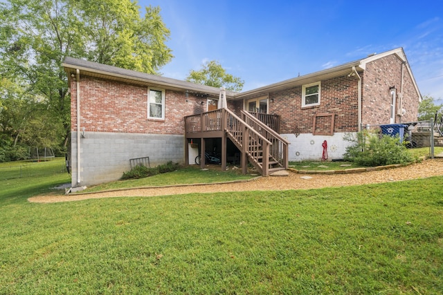 back of house with a yard and a wooden deck