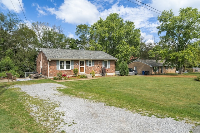 ranch-style house featuring a front lawn