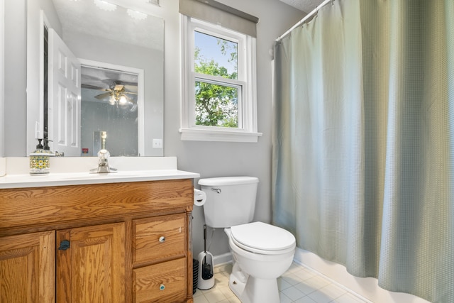 full bathroom with shower / bath combo, tile patterned flooring, ceiling fan, vanity, and toilet