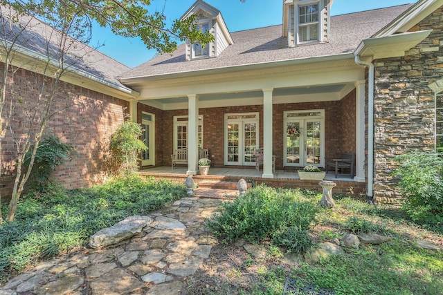 view of exterior entry featuring french doors