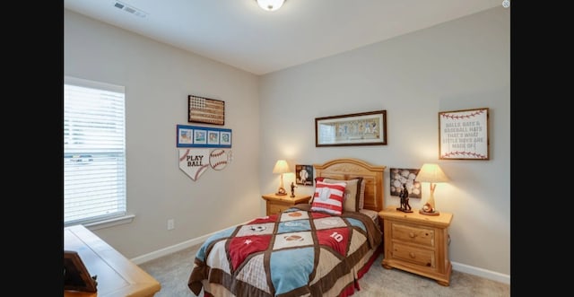 bedroom featuring light carpet