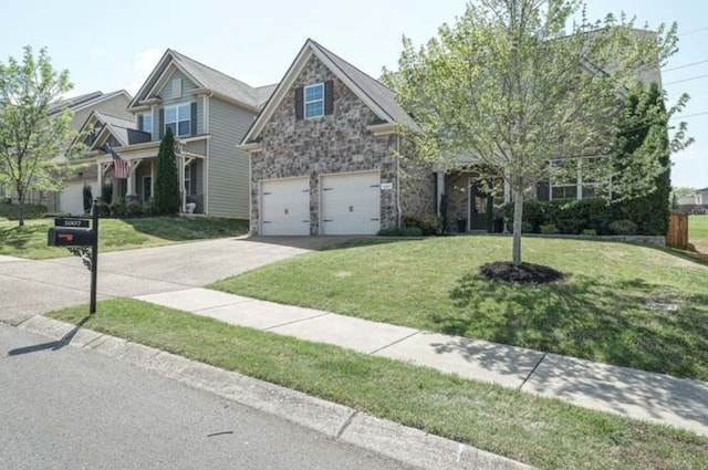 craftsman house featuring a front lawn and a garage