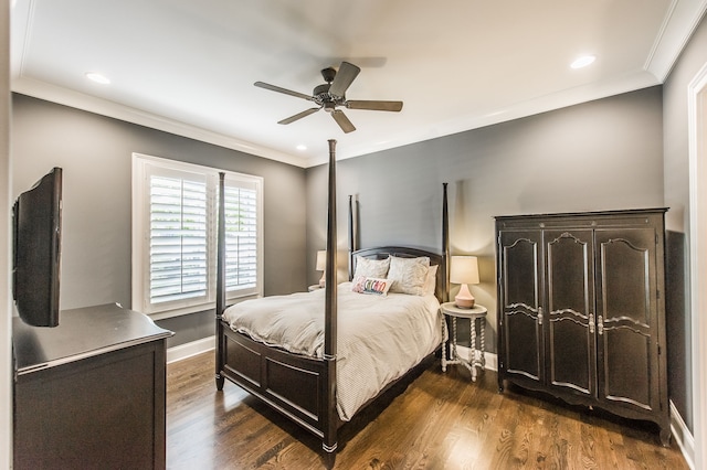 bedroom featuring crown molding, dark hardwood / wood-style flooring, and ceiling fan