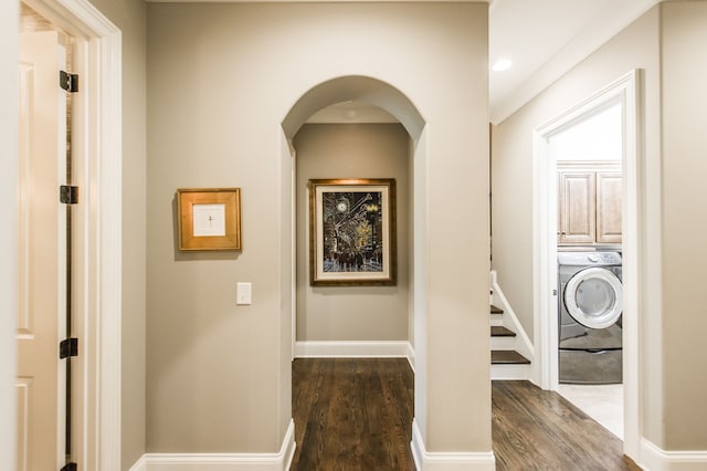 hallway featuring dark hardwood / wood-style flooring and washer / dryer