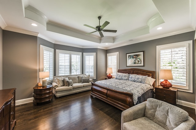 bedroom with multiple windows, ceiling fan, and dark hardwood / wood-style flooring