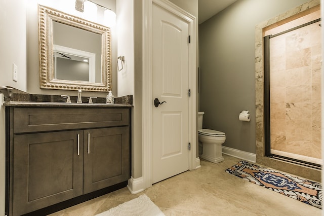 bathroom with tile patterned flooring, a shower, vanity, and toilet