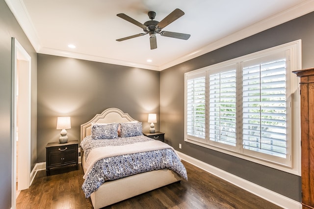 bedroom with crown molding, dark hardwood / wood-style floors, and ceiling fan