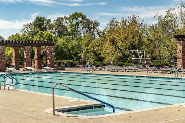 view of swimming pool with a patio area