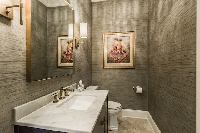 bathroom with tile patterned floors, vanity, and toilet