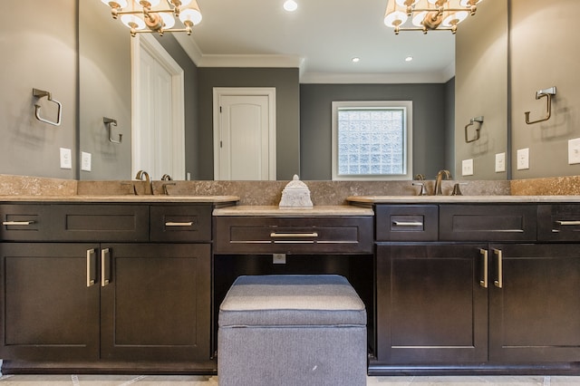 bathroom with tile patterned floors, vanity, and crown molding