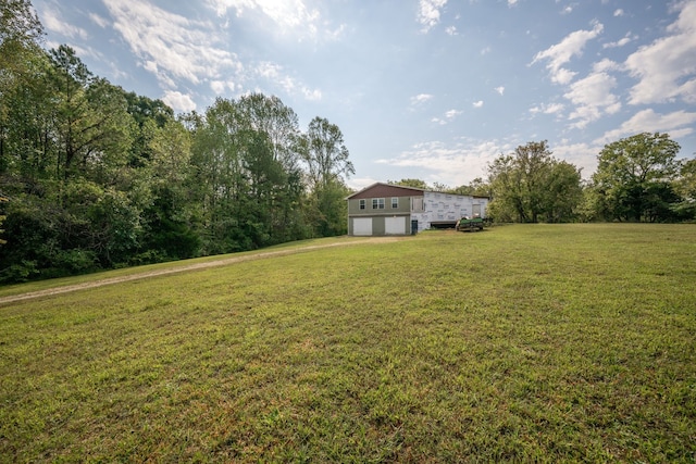 view of yard featuring a garage