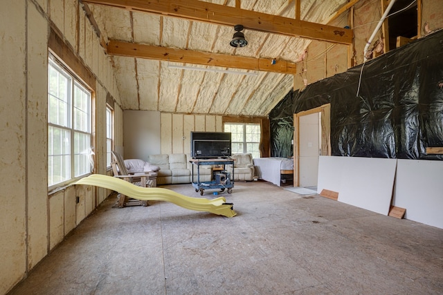 misc room featuring vaulted ceiling with beams