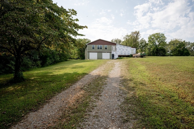 exterior space featuring a front yard and a garage