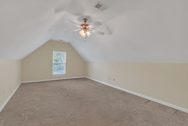 bonus room with ceiling fan, light colored carpet, and vaulted ceiling