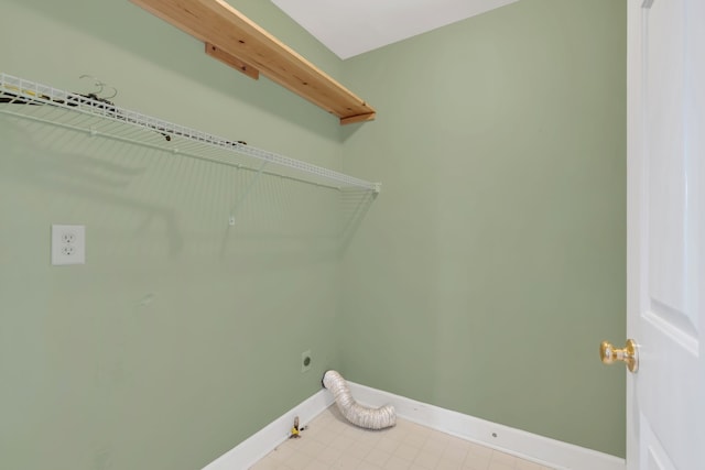 clothes washing area featuring hookup for an electric dryer