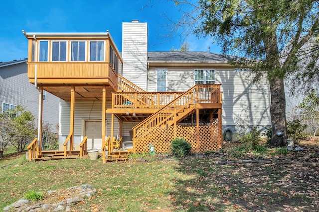 rear view of house featuring a deck and a sunroom