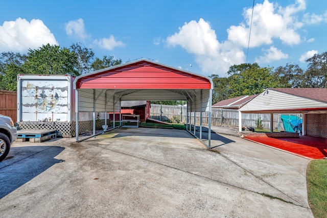 view of parking / parking lot featuring a carport