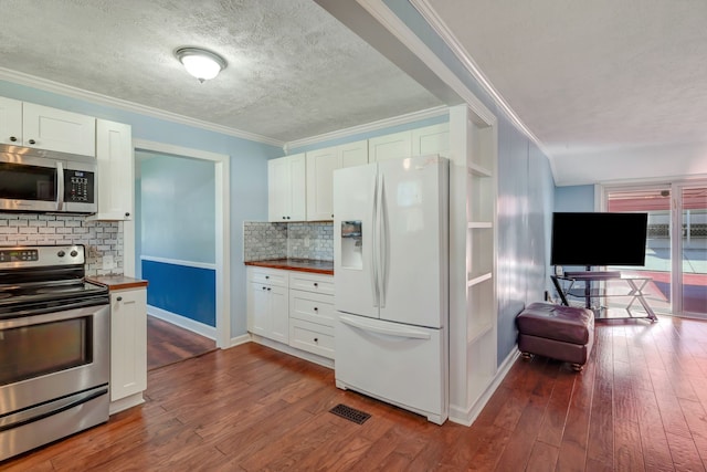 kitchen with white cabinets, tasteful backsplash, stainless steel appliances, dark hardwood / wood-style floors, and wood counters