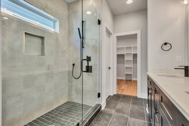 bathroom with vanity, hardwood / wood-style floors, and an enclosed shower