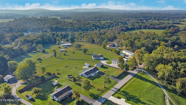 aerial view featuring a wooded view