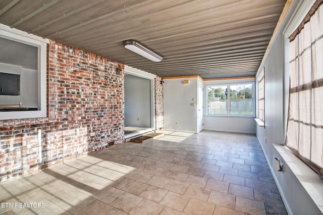 unfurnished sunroom featuring wood ceiling