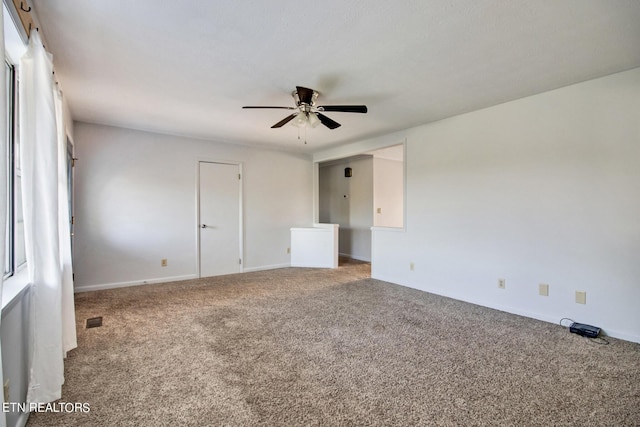unfurnished bedroom with visible vents, baseboards, and carpet flooring