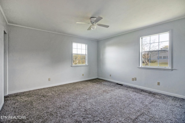 unfurnished room with carpet, baseboards, ornamental molding, and ceiling fan