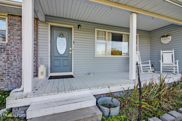 entrance to property with covered porch