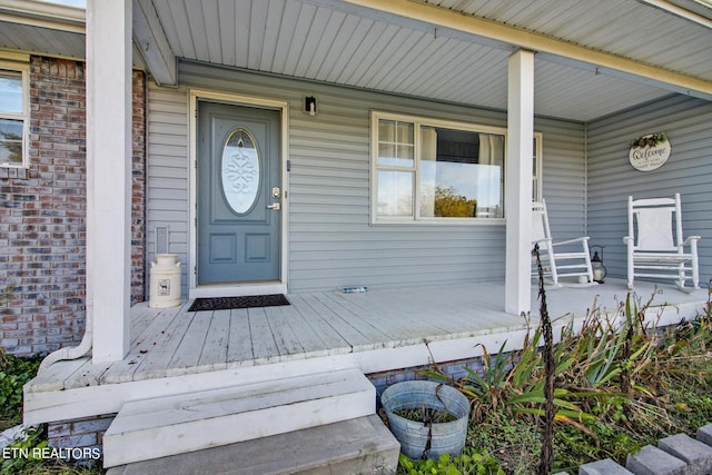 property entrance featuring covered porch