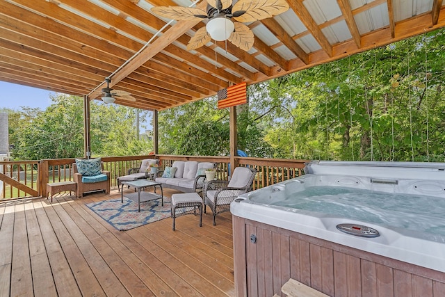 wooden terrace featuring an outdoor hangout area, a hot tub, and ceiling fan