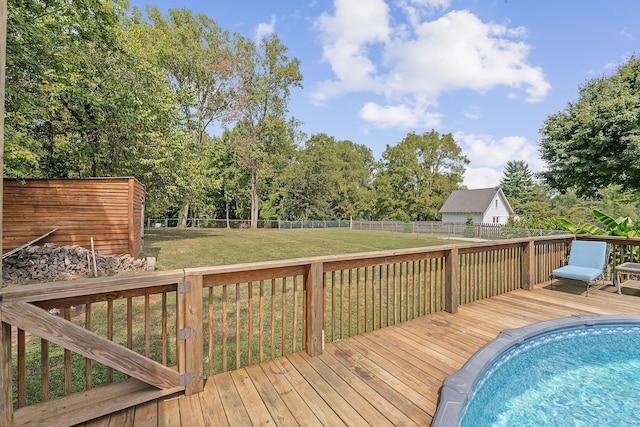 wooden terrace featuring a yard