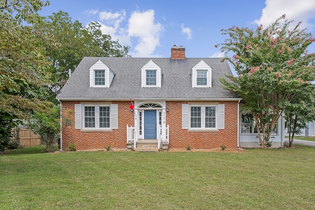 cape cod house with a front yard