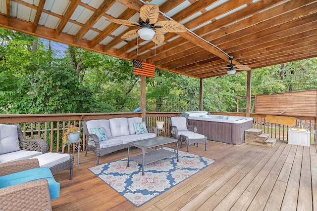 wooden deck featuring an outdoor living space, ceiling fan, and a hot tub