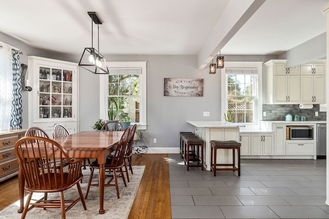 dining area with dark wood-type flooring