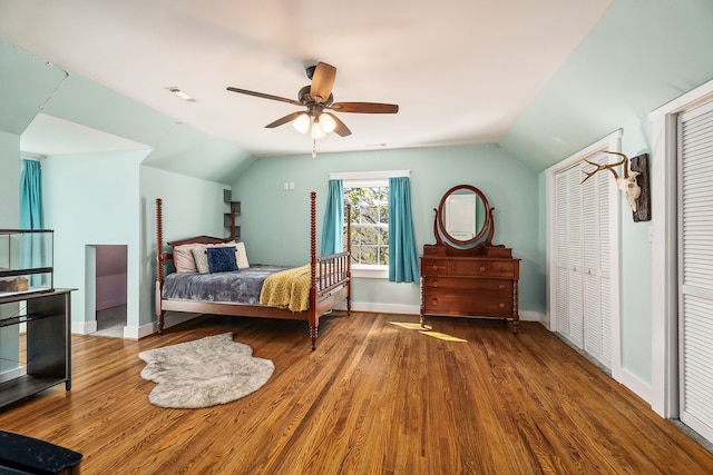 bedroom featuring ceiling fan, lofted ceiling, and hardwood / wood-style floors