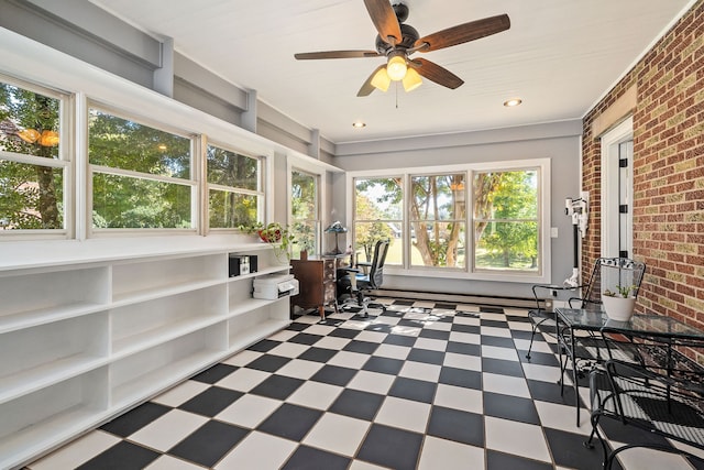 sunroom / solarium with ceiling fan