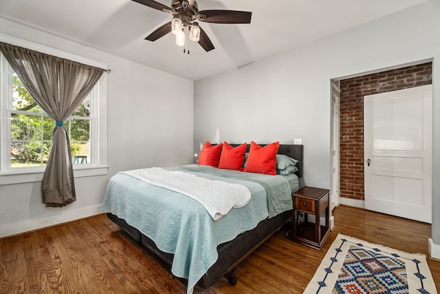 bedroom featuring dark wood-type flooring and ceiling fan