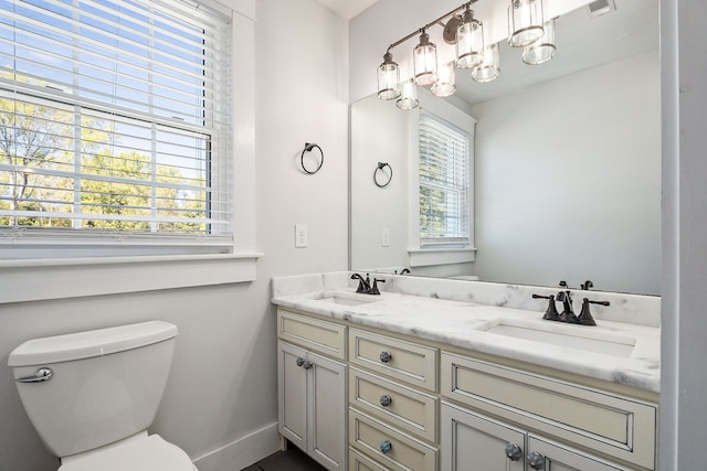 bathroom with vanity and toilet