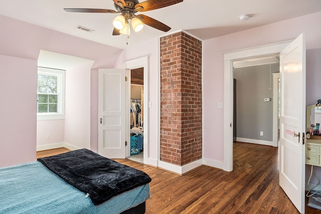 bedroom with ceiling fan and dark hardwood / wood-style flooring