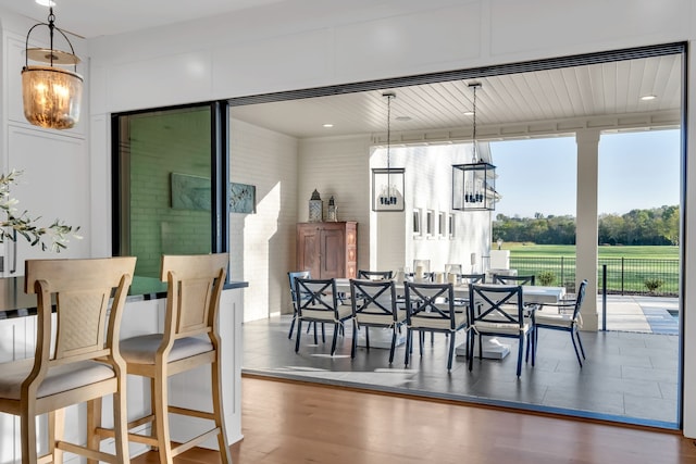 dining room with a notable chandelier and hardwood / wood-style floors